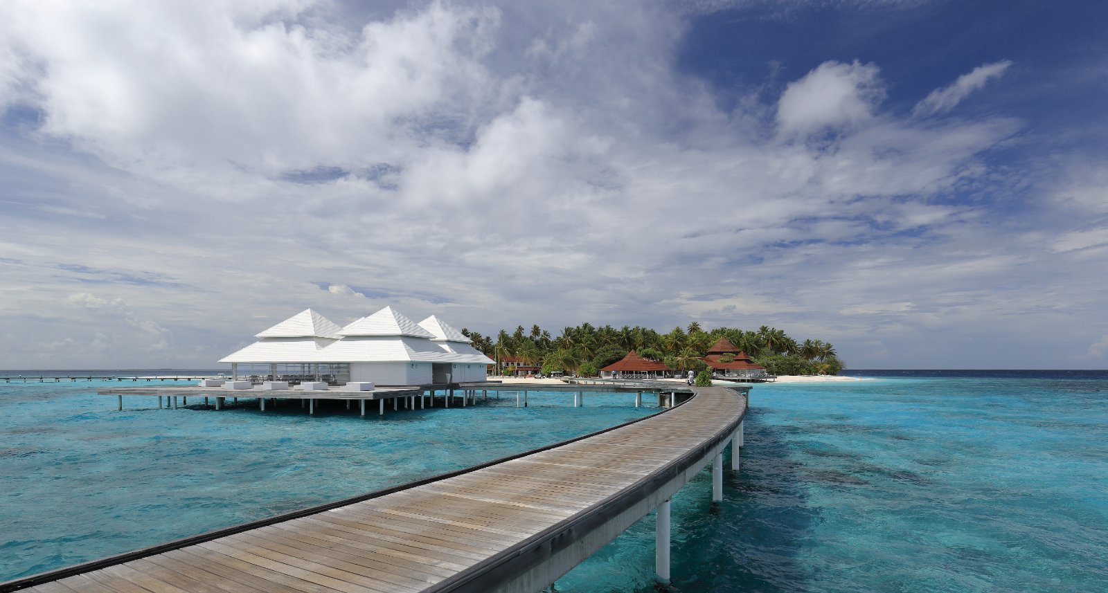 Maldives overwater pavilion and turquoise lagoon